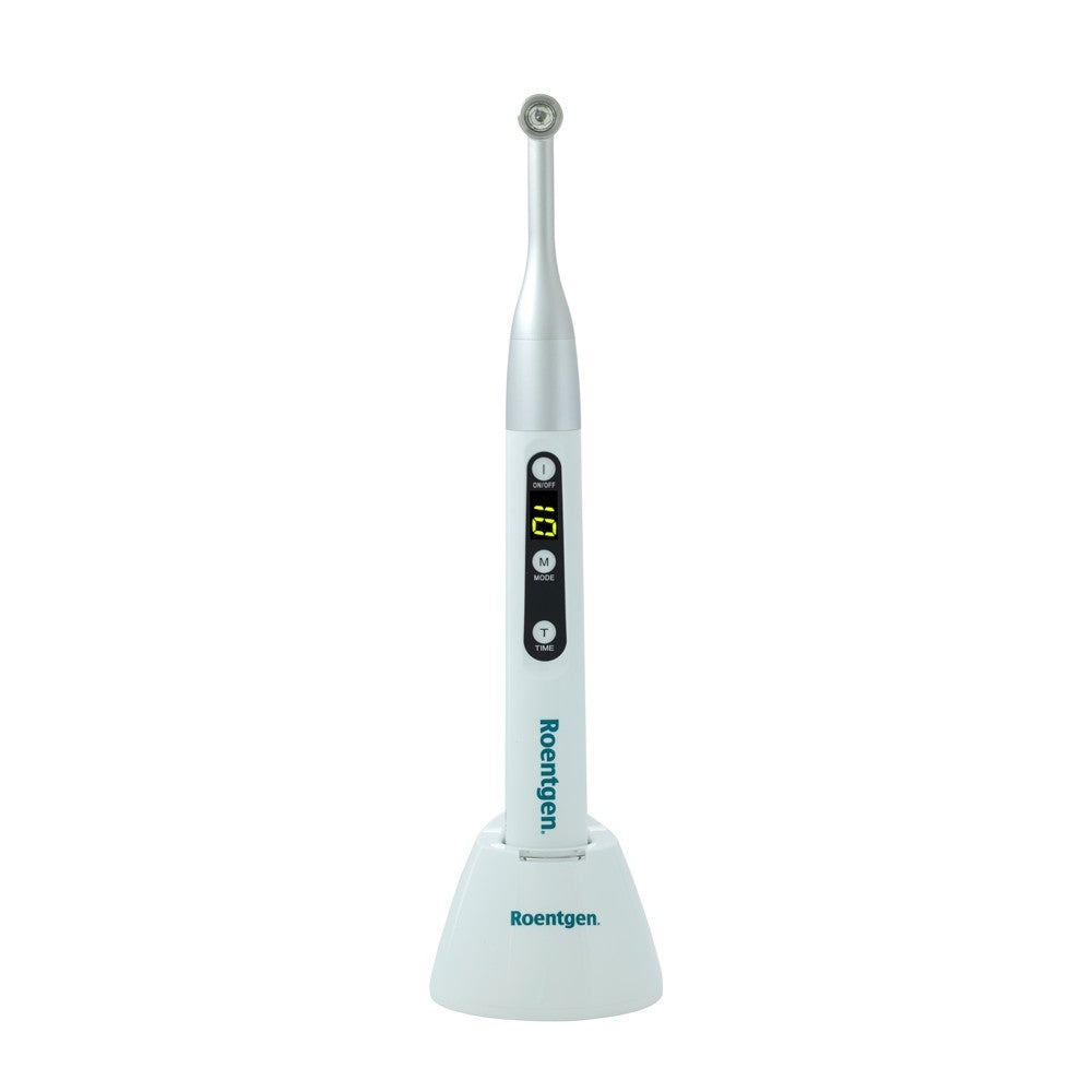 Lámpara de fotocurado blanca de la marca Beracah Médica, con diseño compacto para uso en odontología y estética dental.